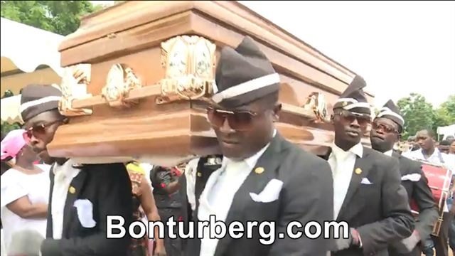 Coffin Dance / Dancing Pallbearers meme image: several pallbearers in formal uniforms carrying a coffin on their shoulders.