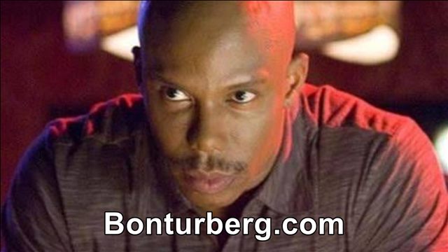 James Doakes Reaction Images meme image: A close-up of a bald man with a moustache looking sideways with a suspicious expression.